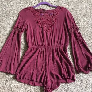 Maroon long sleeved romper with details